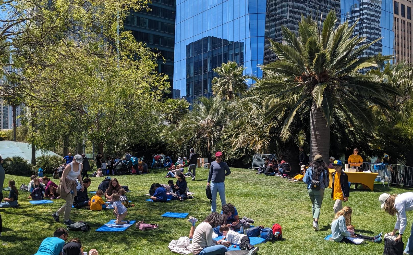 Parents with their children at Salesforce park.