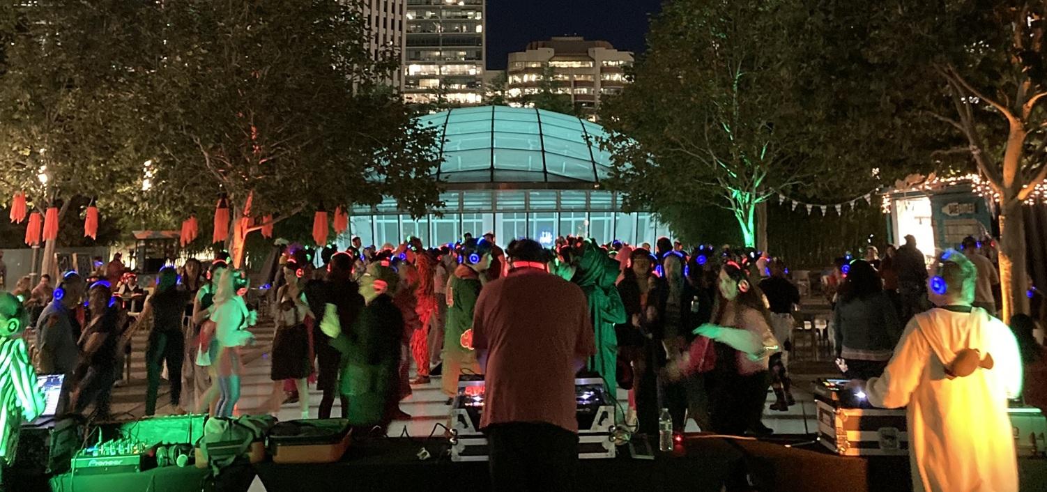 Photo of the Halloween Silent Disco at night in the Main Plaza.